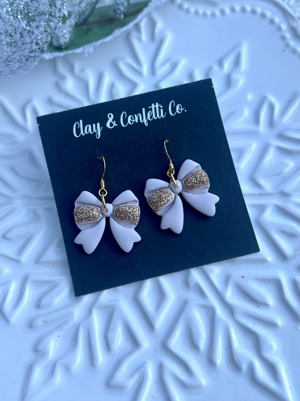 Cream with gold bow dangle