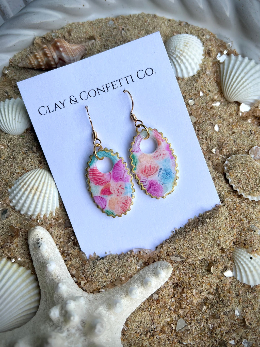colorful seashell pattern in oval ribbed dangle