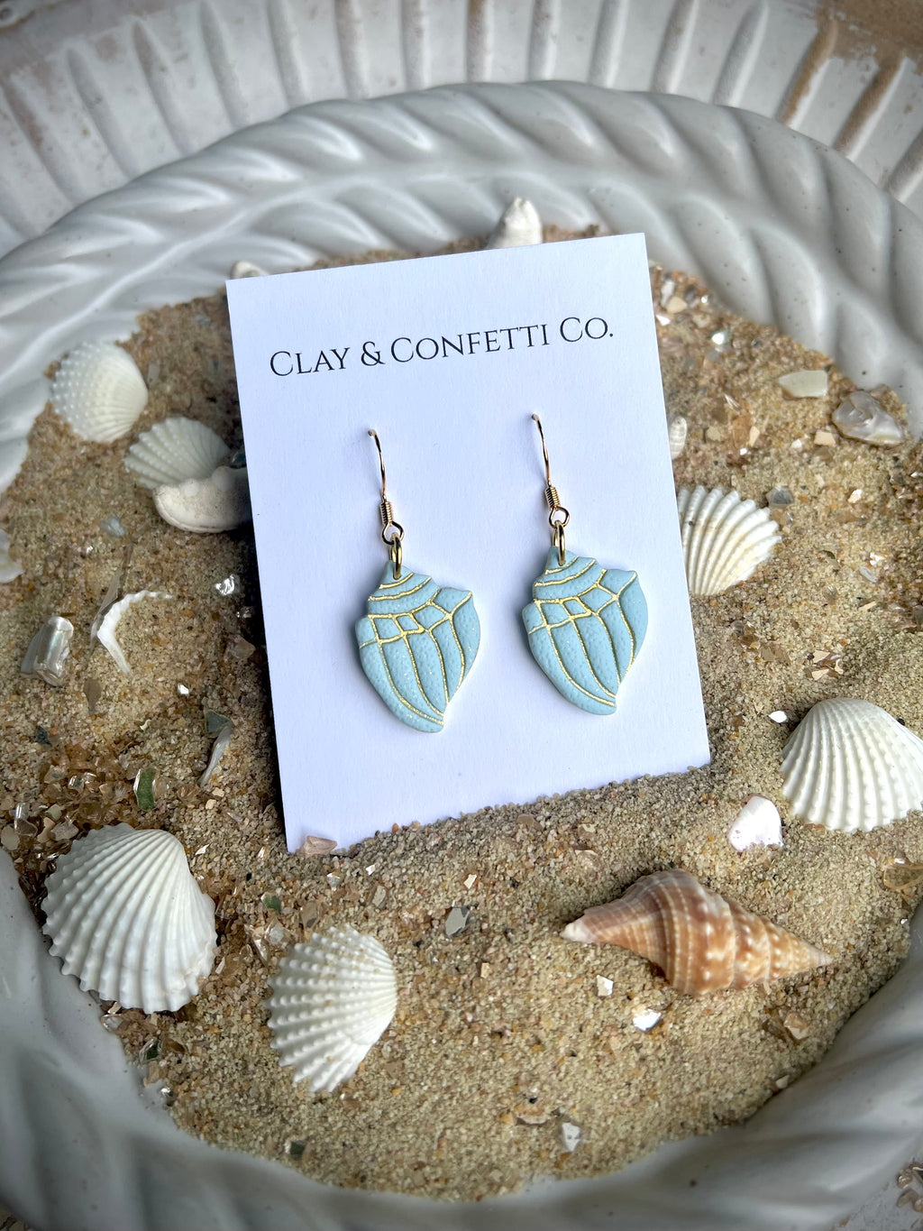 aqua with gold imprint conche shell dangle