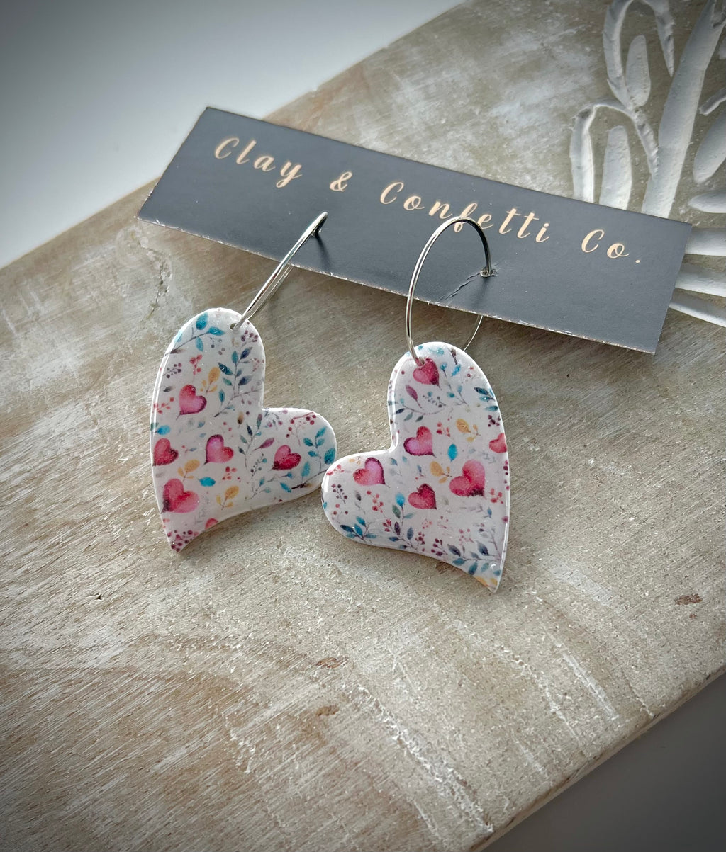 Red hearts with multicolor sprigs watercolor pattern
