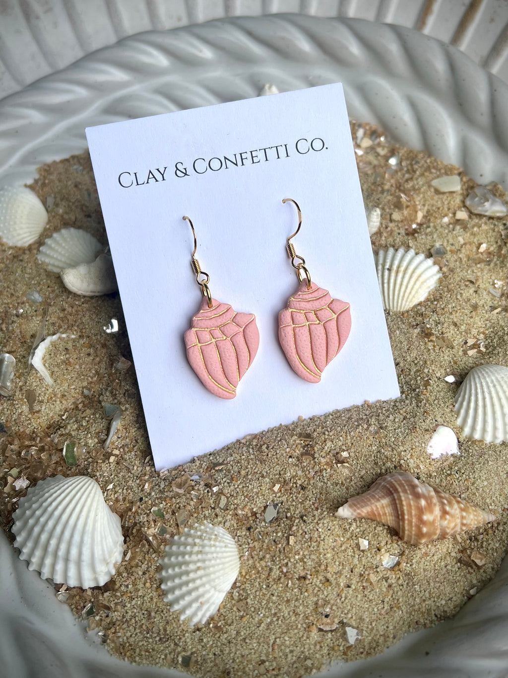 coral with gold imprint conche dangle