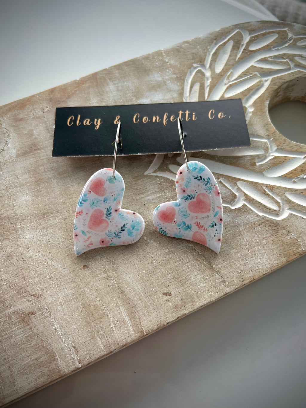 Pink watercolor hearts and blue sprigs pattern