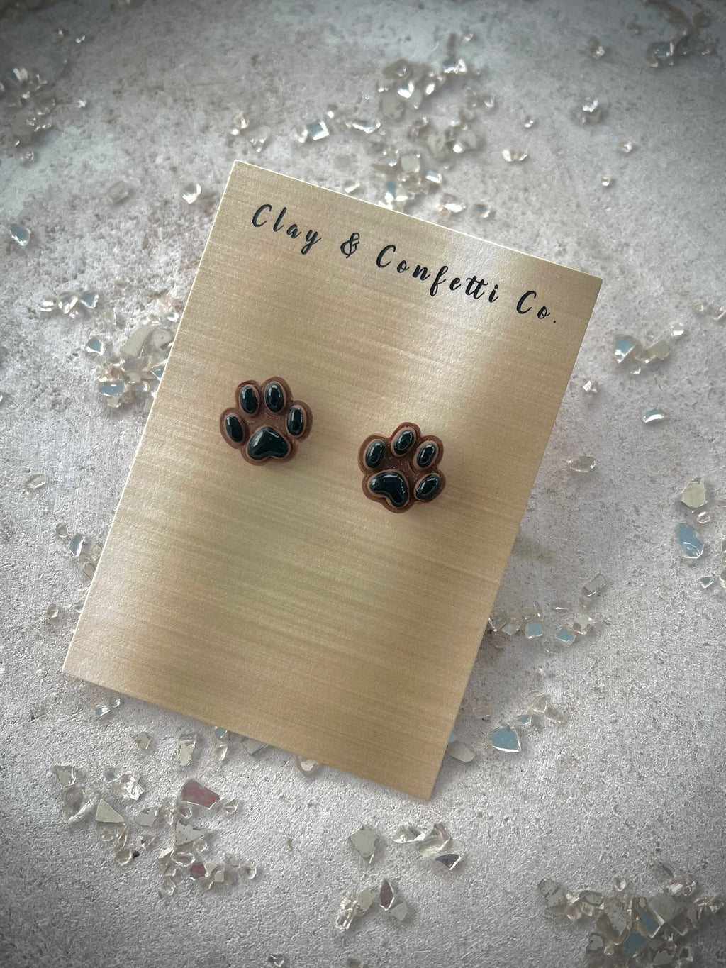 Brown paw black pad studs