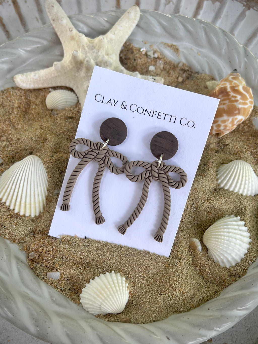 Tan rope dangle with topper