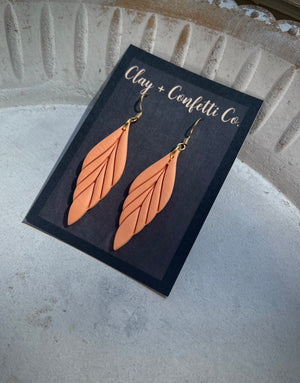 Grey feather , coral feather , light pale green feather