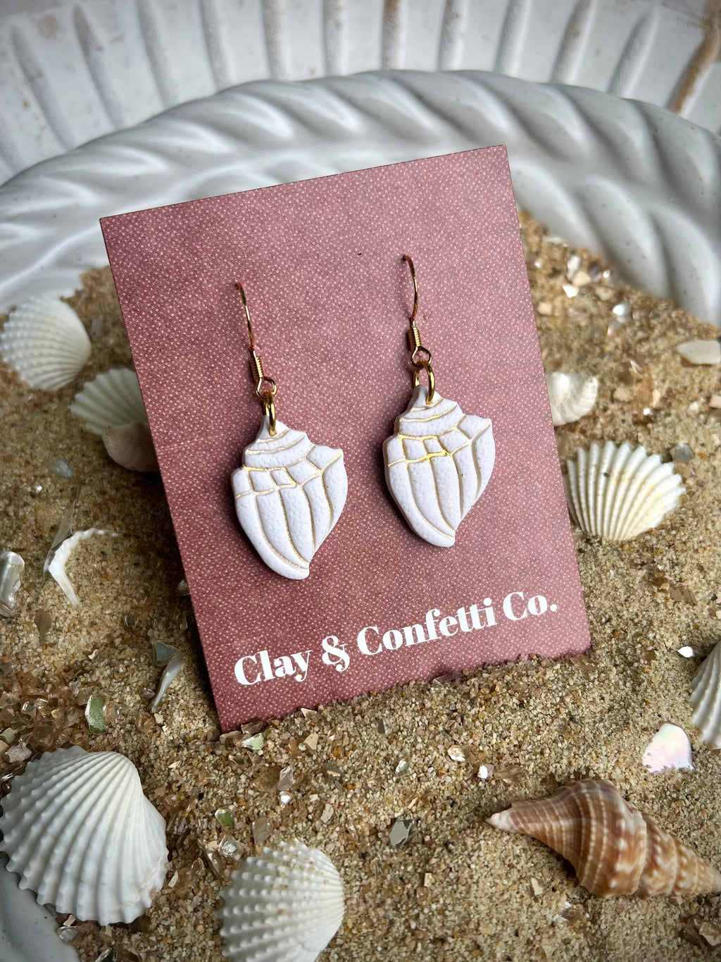 cream with gold imprint conche shell dangle