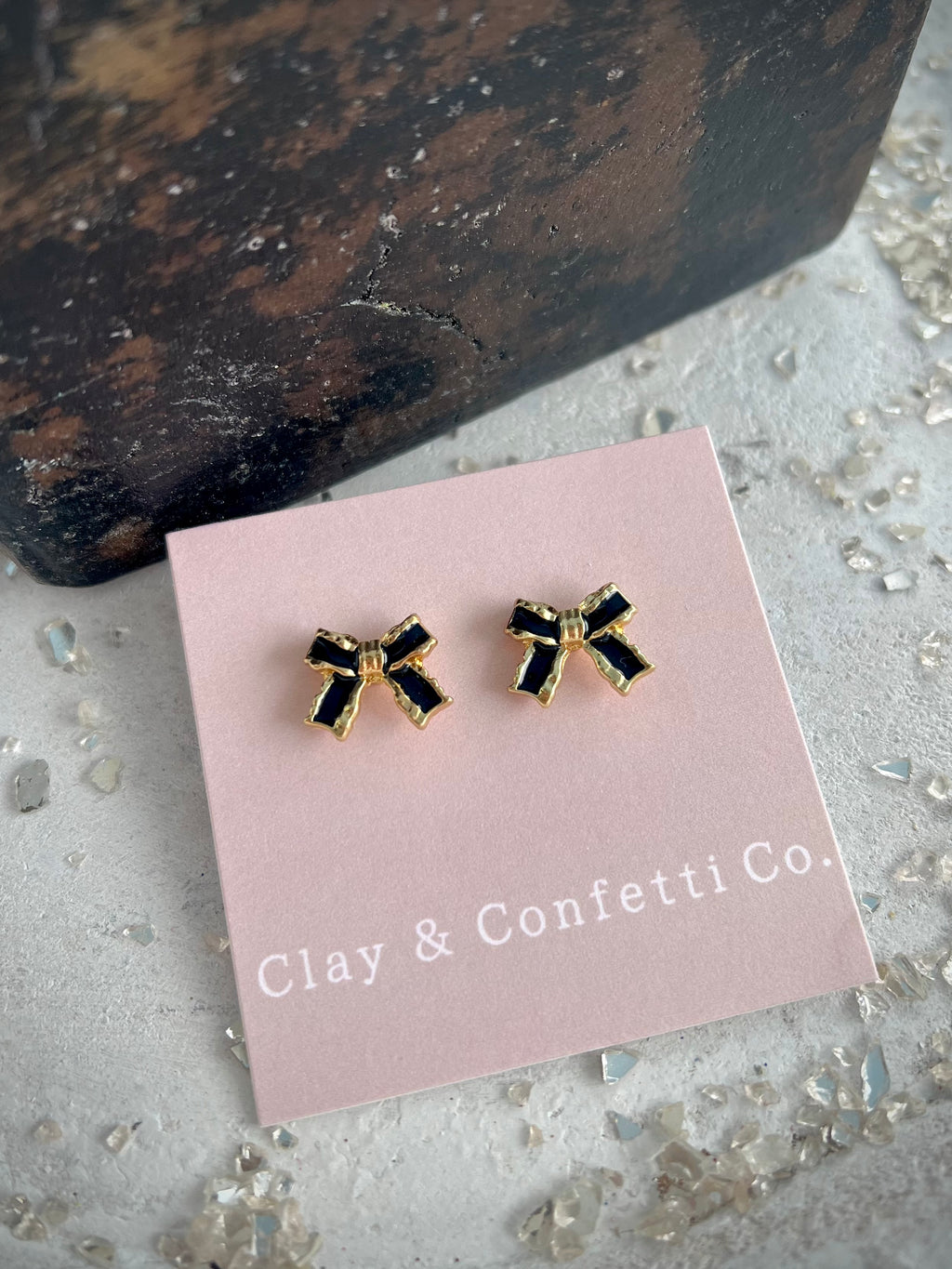 Black and gold bow stud