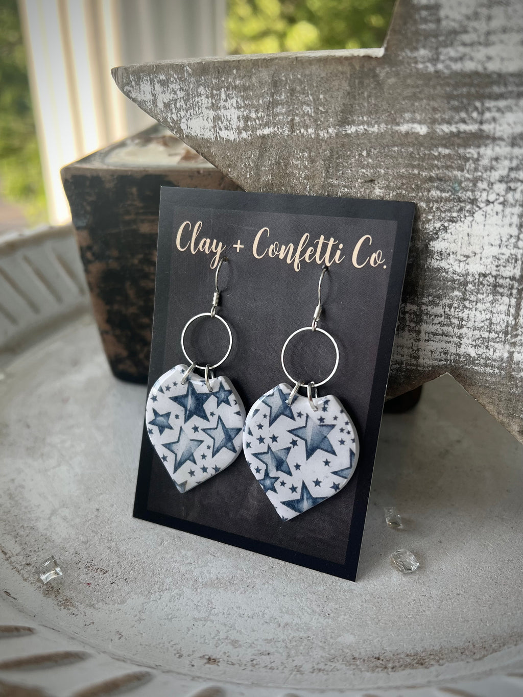 Faded blue star featherly dangle