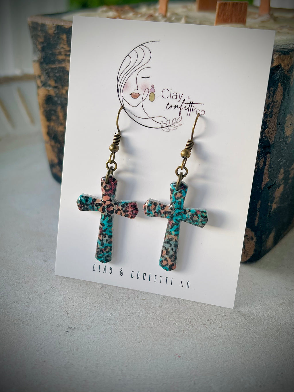 Aqua cheetah cross dangle