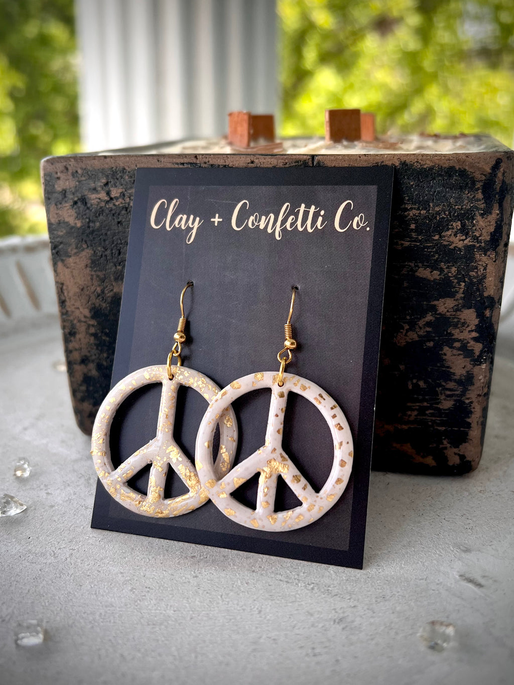 White peace sign with gold flecks