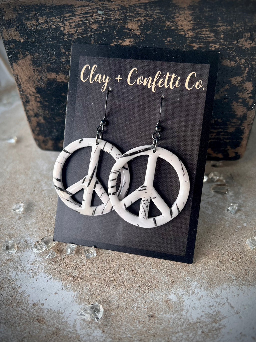 Marked black and cream peace dangle