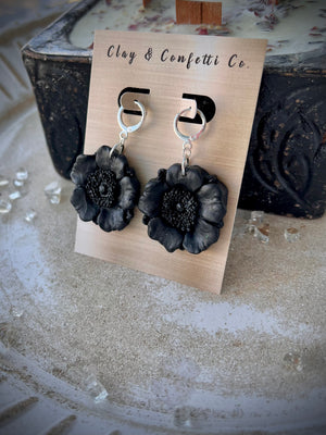 Black poppy on a silver huggie