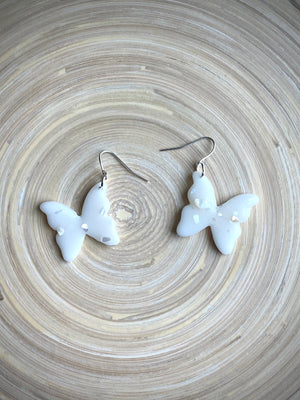 Milk glass butterfly with shells dangle