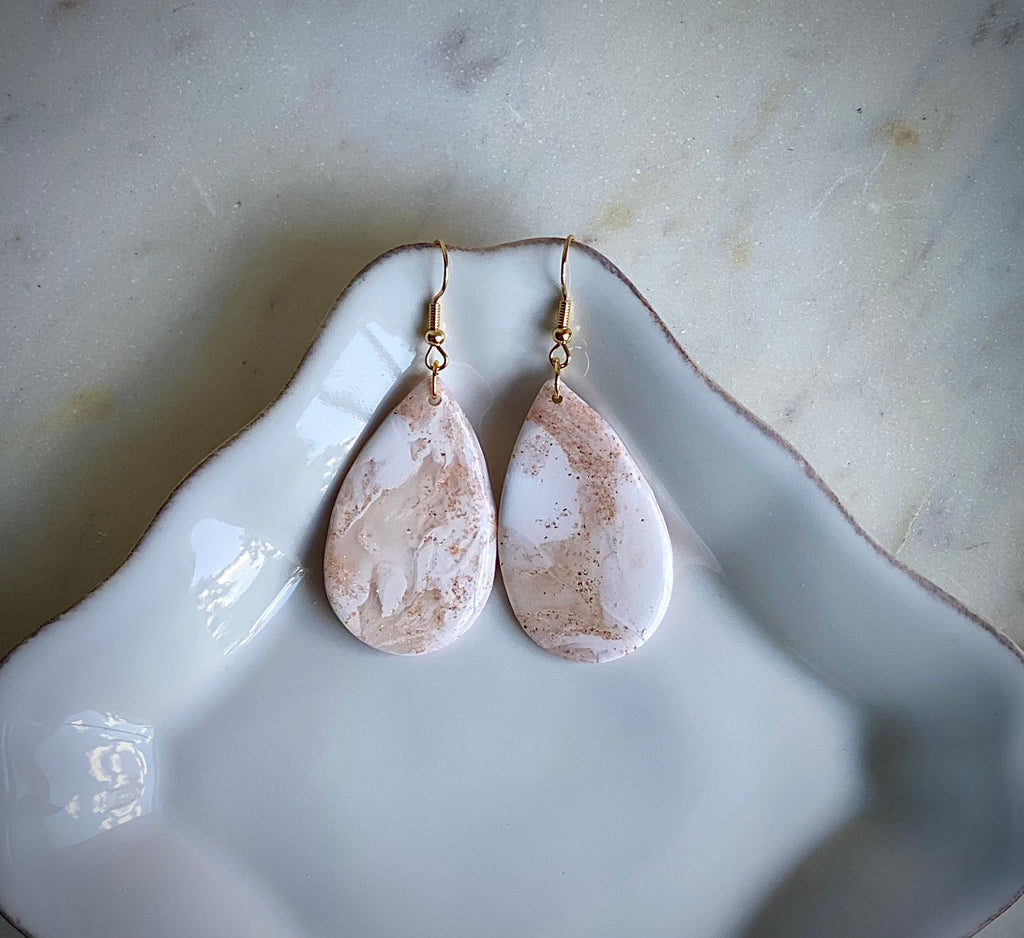 Creamy golden translucent white tear drop