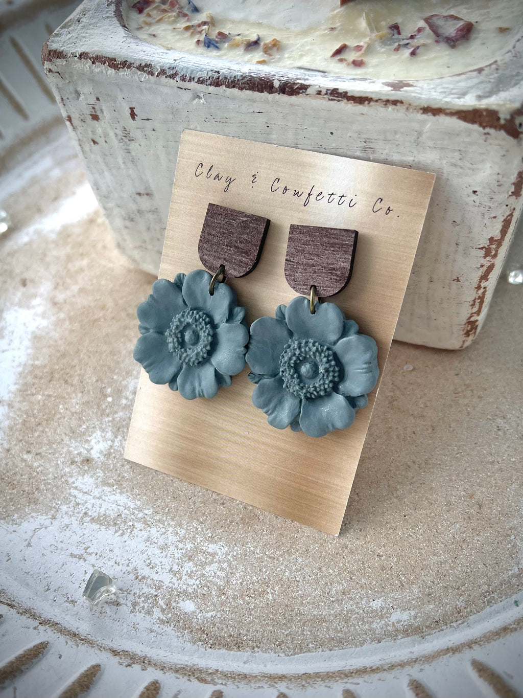 Green blue poppy on wood topper