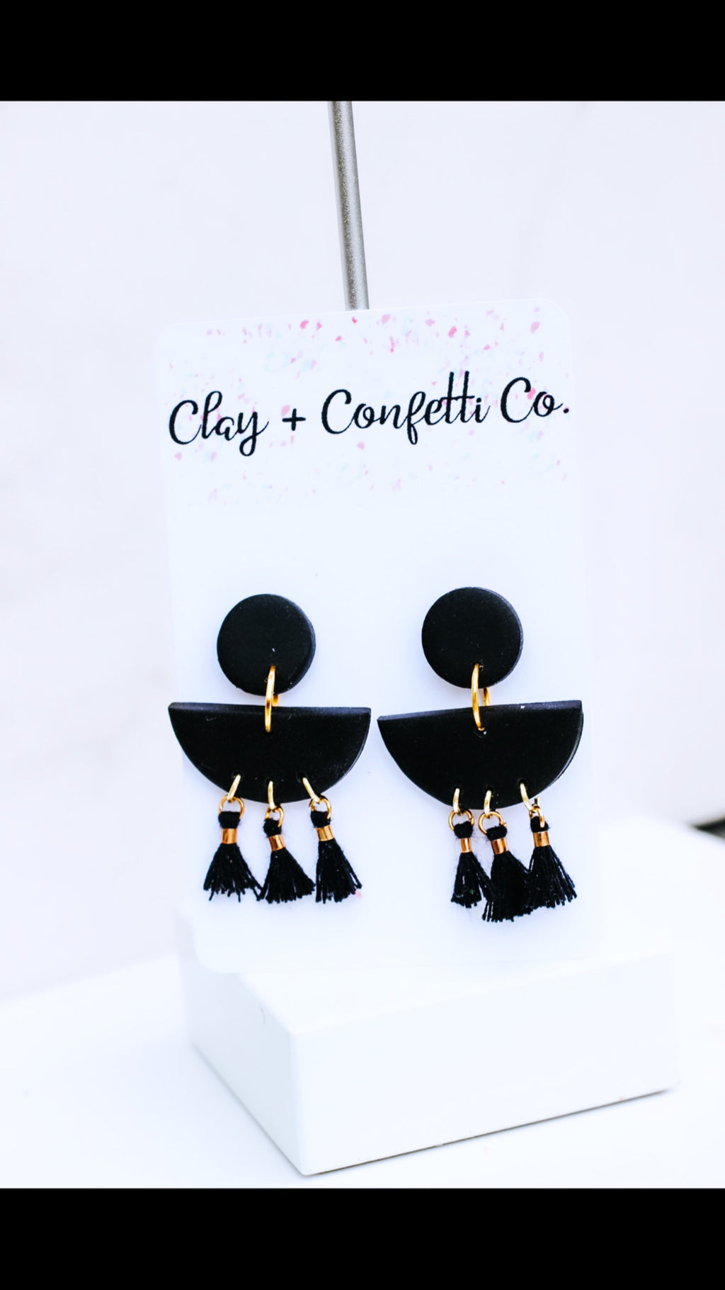 Black tassel dangle