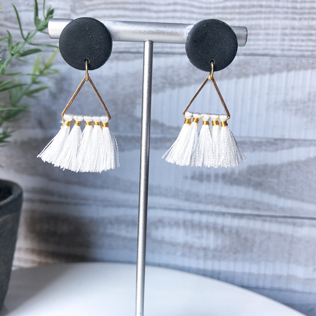 Black stud with white tassel
